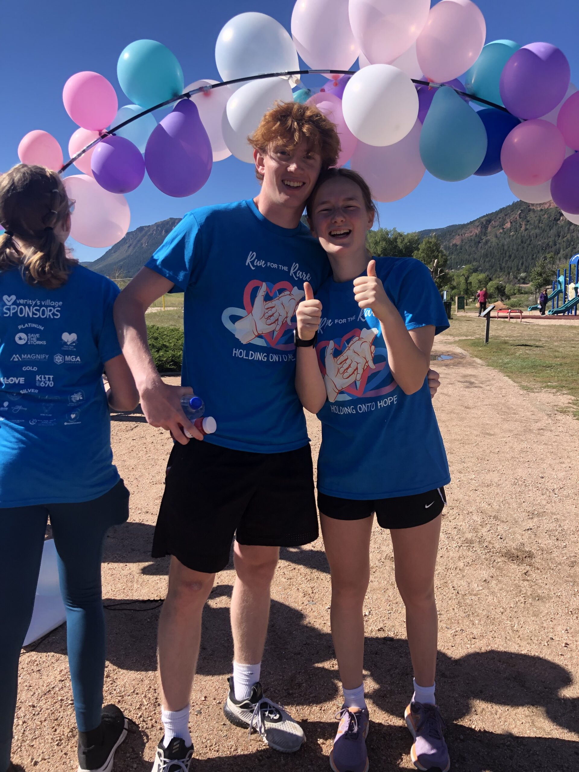 Run for the Rare 2023 - a man and a lady smiling after the run giving thumbs up